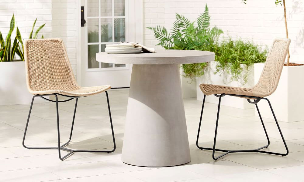 Concrete Dining Table and woven wicker Chairs with black legs