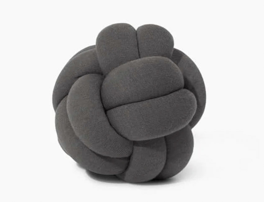 Modern knotted throw pillow made of soft organic cotton