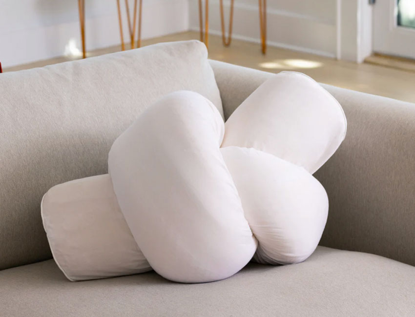 Cuddler Body Pillow on the sofa