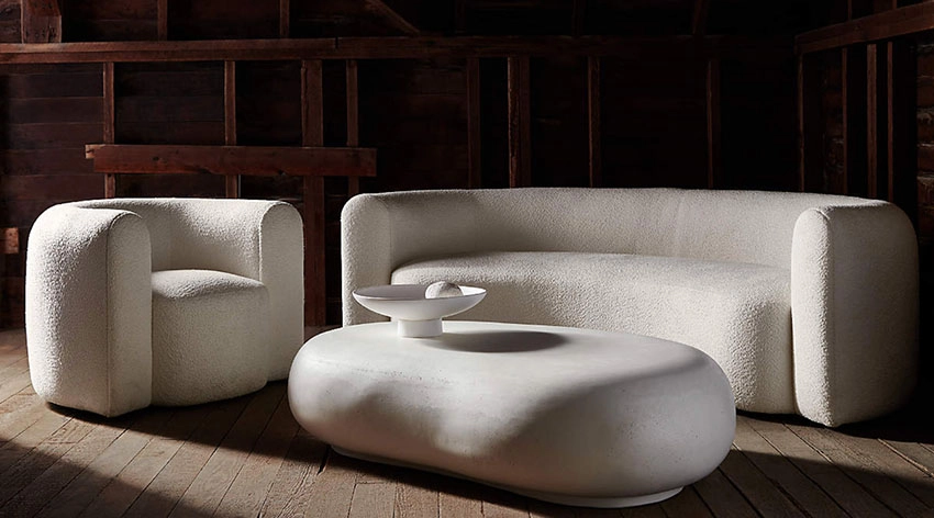 White Curved Boucle Sofa with a contemporary design, an accent chair, a rounded white coffe table