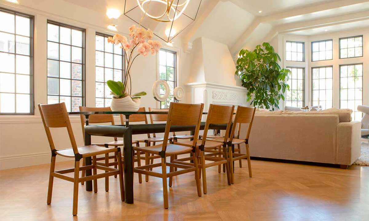 Wooden Dining Chairs arranged in a living room around a rectangular dining table