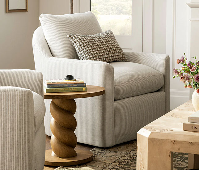 Swivel Chair in a living room near a rounded wooden coffee table