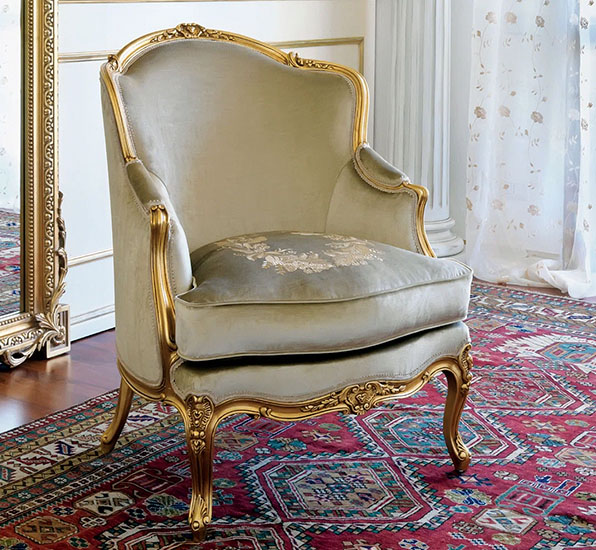 Wide Bergère Armchair with wood frame painted in Gold