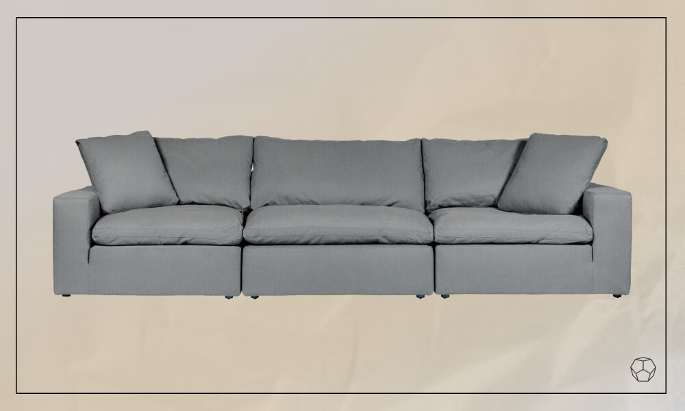 Family sofa with grey upholstery and two large throw pillows