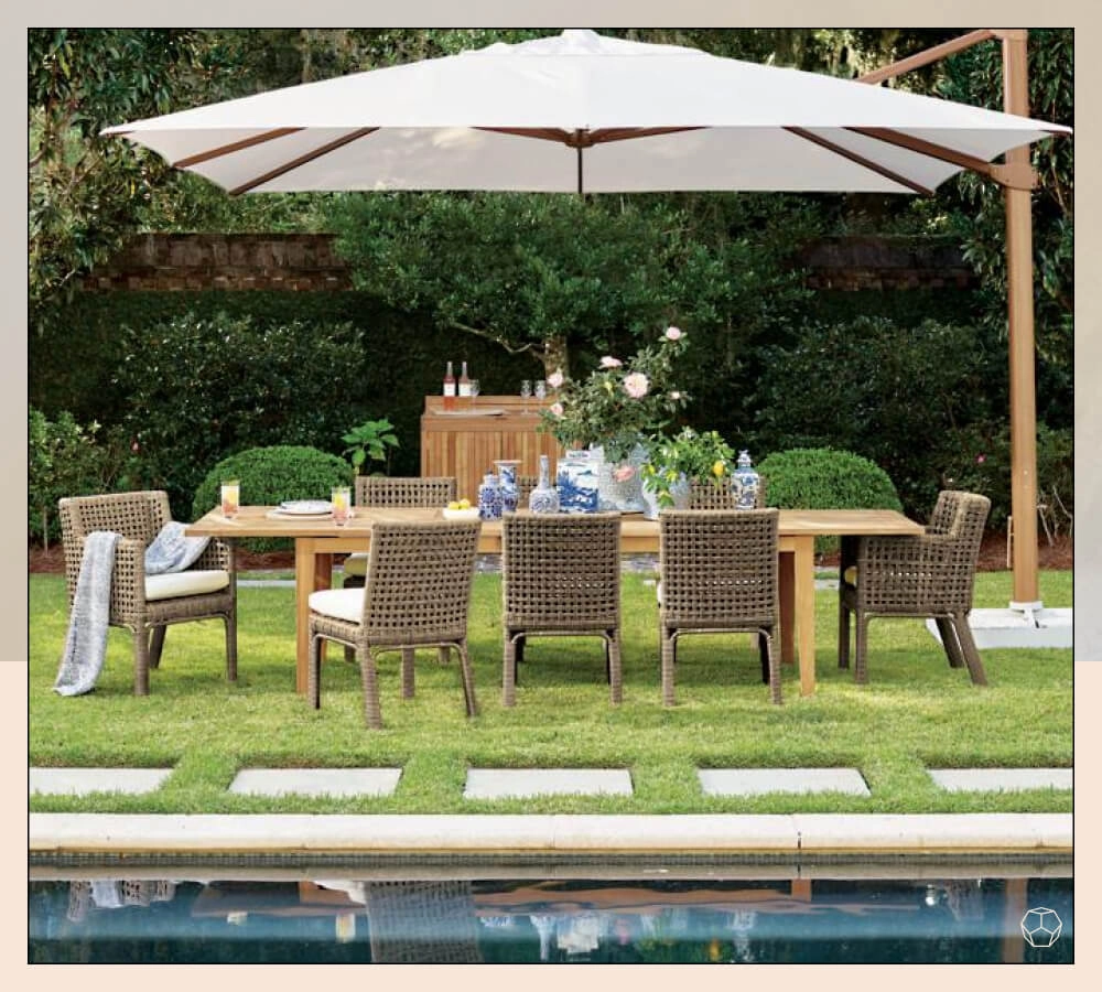 Wooden framed Cantilever Umbrella with white fabric near a outdoor dining table with chairs