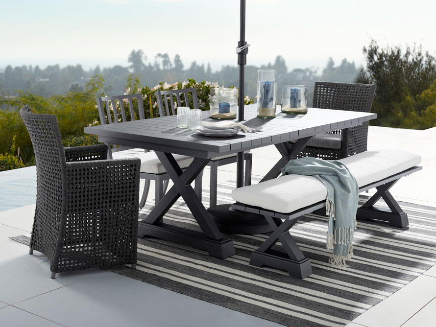 Patio dining set including table, chairs, and umbrella for outdoor dining