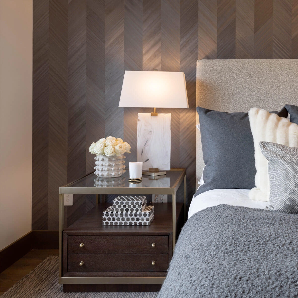 Modern nightstand with two drawers and a storage space, and flowers and a lamp in the top