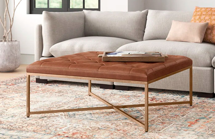 Cocktail ottoman in brown lether and metal legs