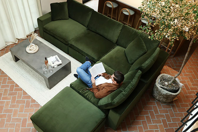 L-shaped green sofa in a room