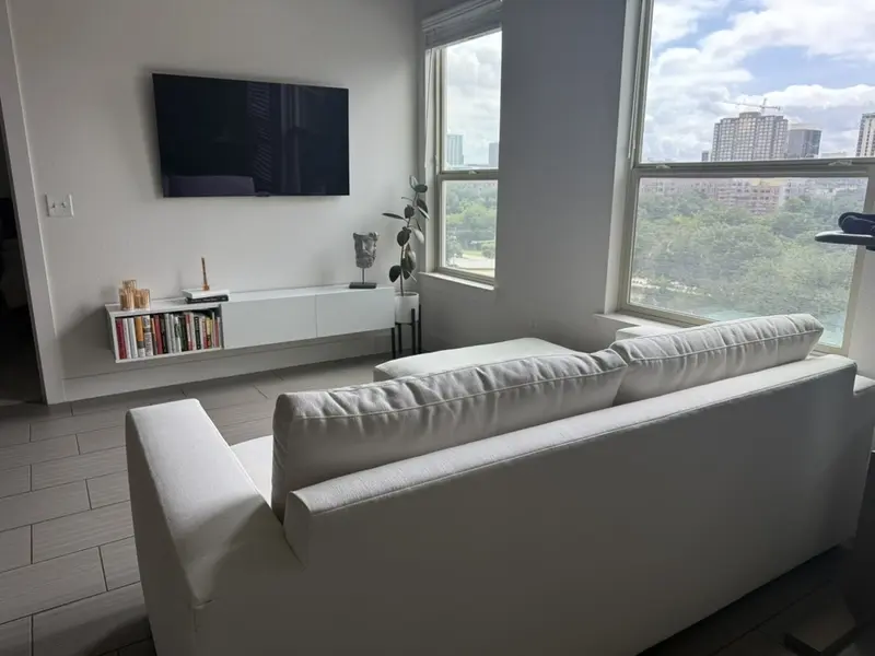 Sofa placed in front of TV