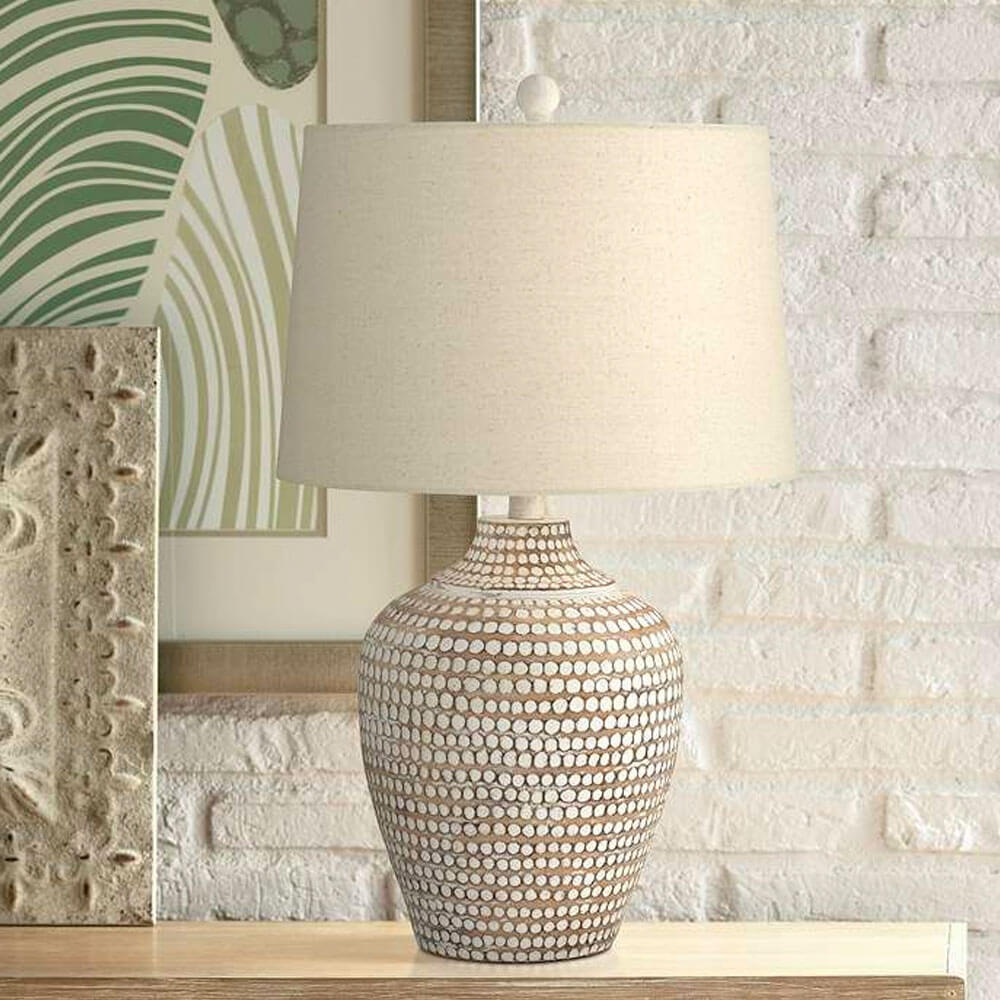 Neutral Earth Polka Dot Jug Table Lamp in a table near artwork in the wall