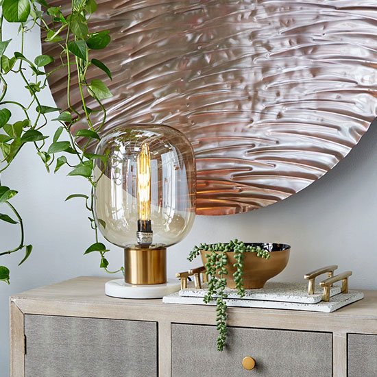 Kerosene looking Bedroom Lamp in a desk near plants