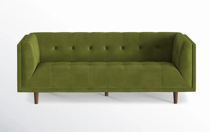olive green upholstered velvet sofa with wooden legs