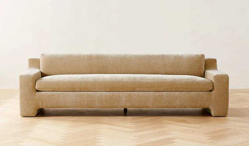 sand velvet upholstered modern sofa with a low profile design