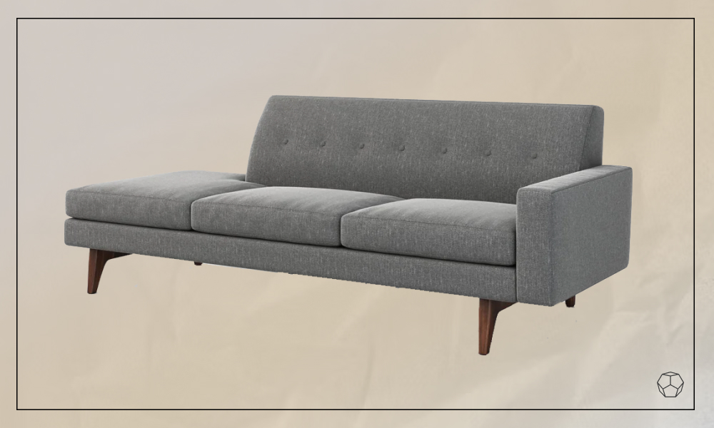 grey upholstered sofa with wooden legs