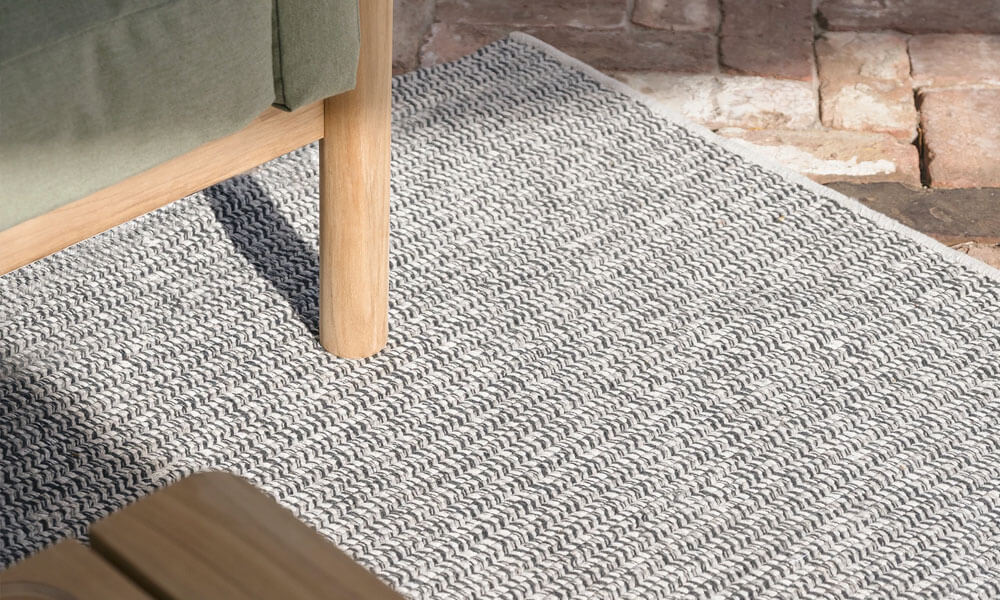 Grey Braid Rug with a couch