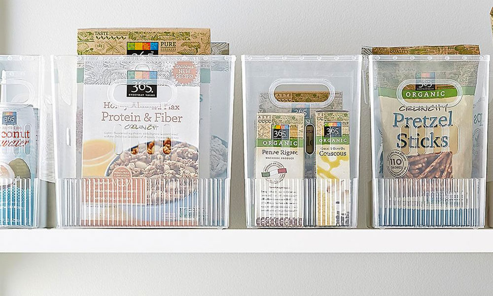 clear bins with food in it in a white shelf