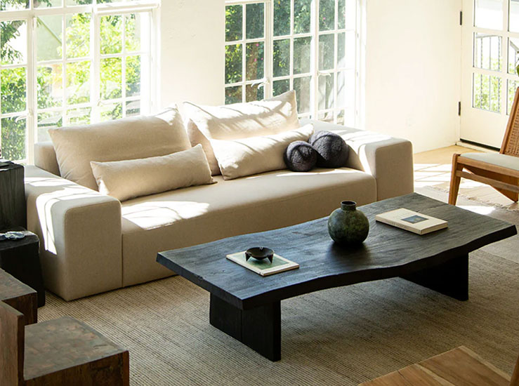 Black Wooden Coffee Table and White sofa on a rug
