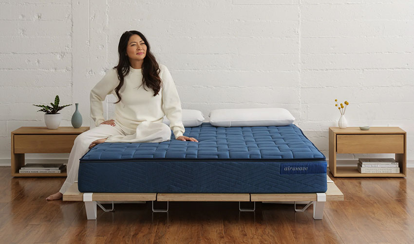 Woman seating on comfortable mattress