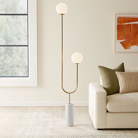 The gold metal floor lamp with marble base