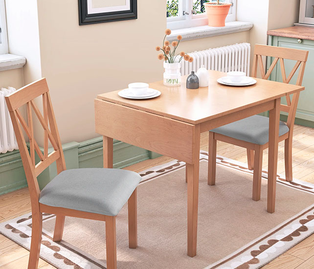 Wooden drop leaf dining table and two dining chairs