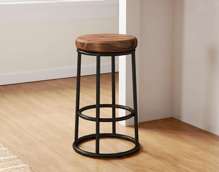 Bar stool with black metal base and wooden top