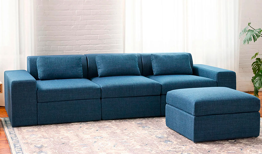 Modular sofa with ottoman in blue performance upgolstery