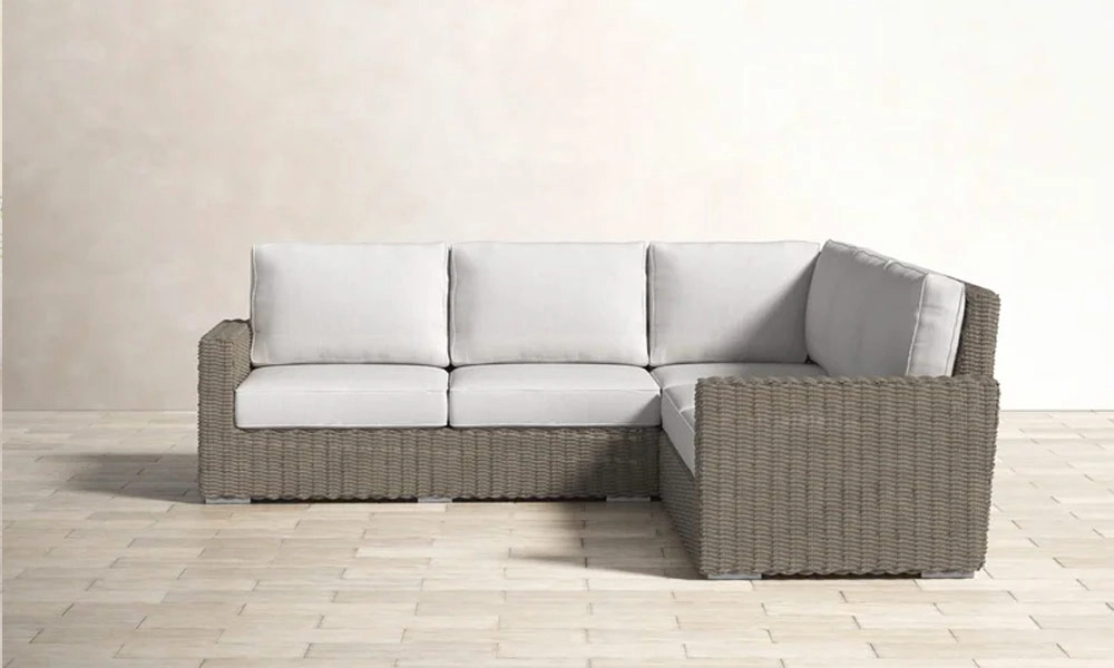 Wicker Outdoor Sofa with white cushions
