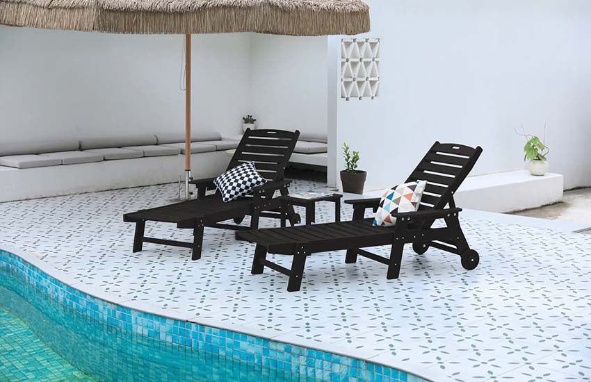 Two Lounge Chairs with side table near pool