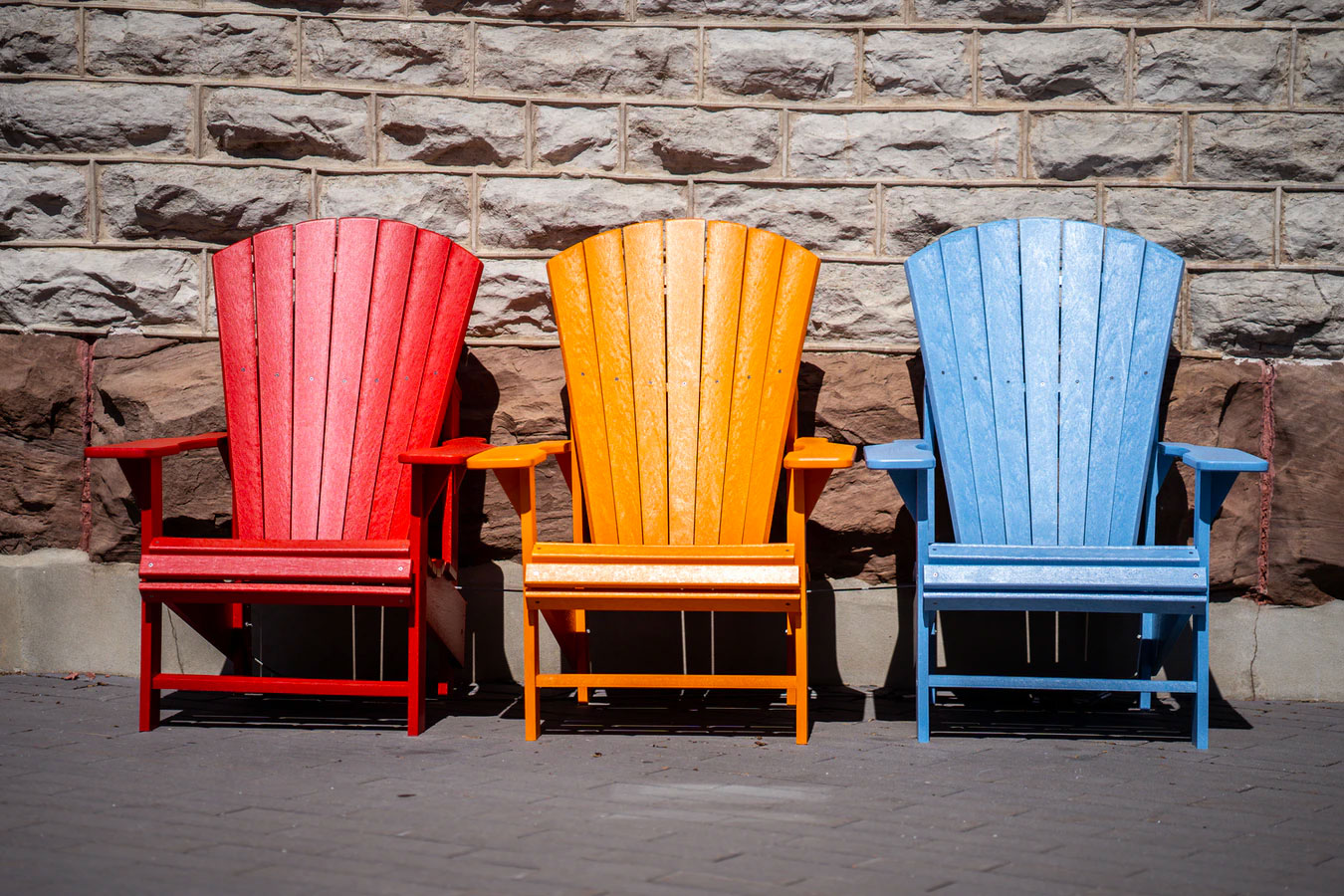 Tree Colorful Adirondack Chairs, red, yellow and blue.