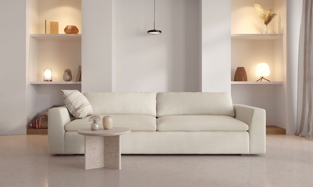 White modern modular sofa in a minimalistic living room with a rounded coffee table
