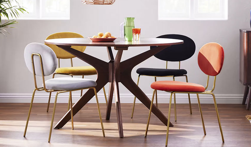 Round Mid-Century Modern Dining Table and colored chairs