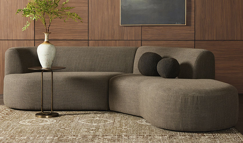 Brown Curved Sectional with ball pillows