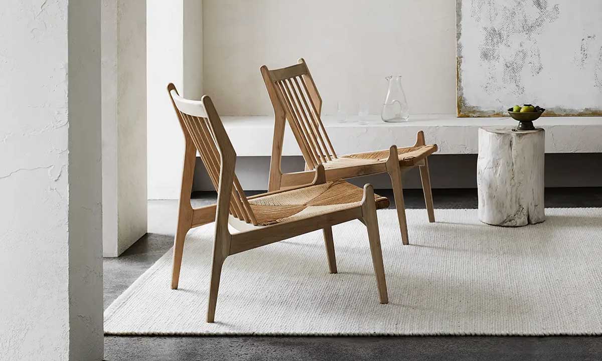 Ivory white Rug in a modern space with two wooden accent chairs