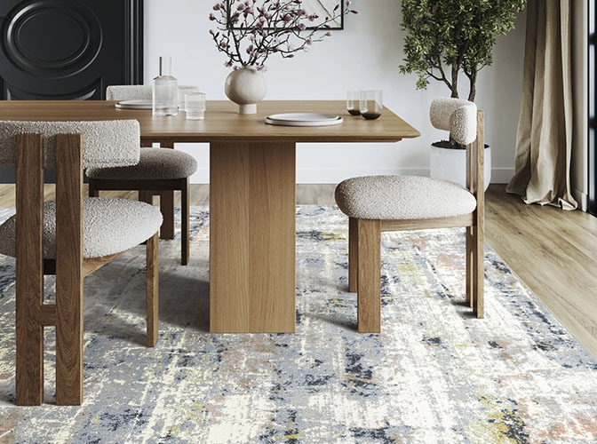 Rextured light gray and blue wool rug in a dining oom