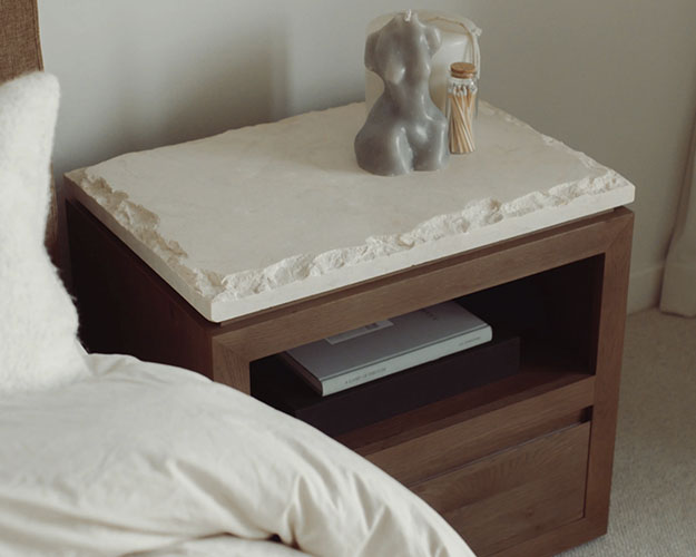 Natural wood nightstand with marble top, shelf and one drawer