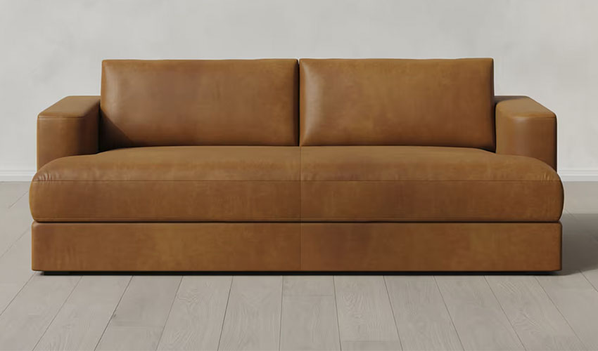 Sand leather sofa with hidden legs and curved arms