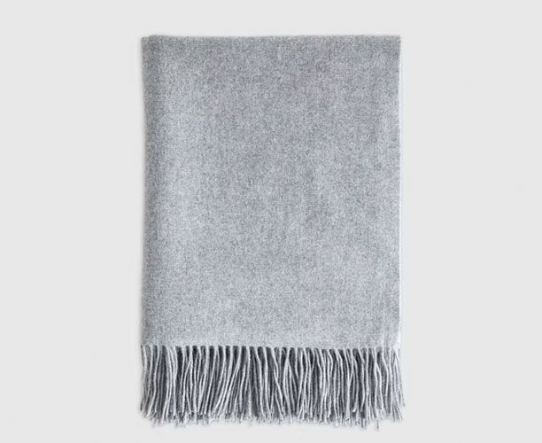 Folded grey throw blanket