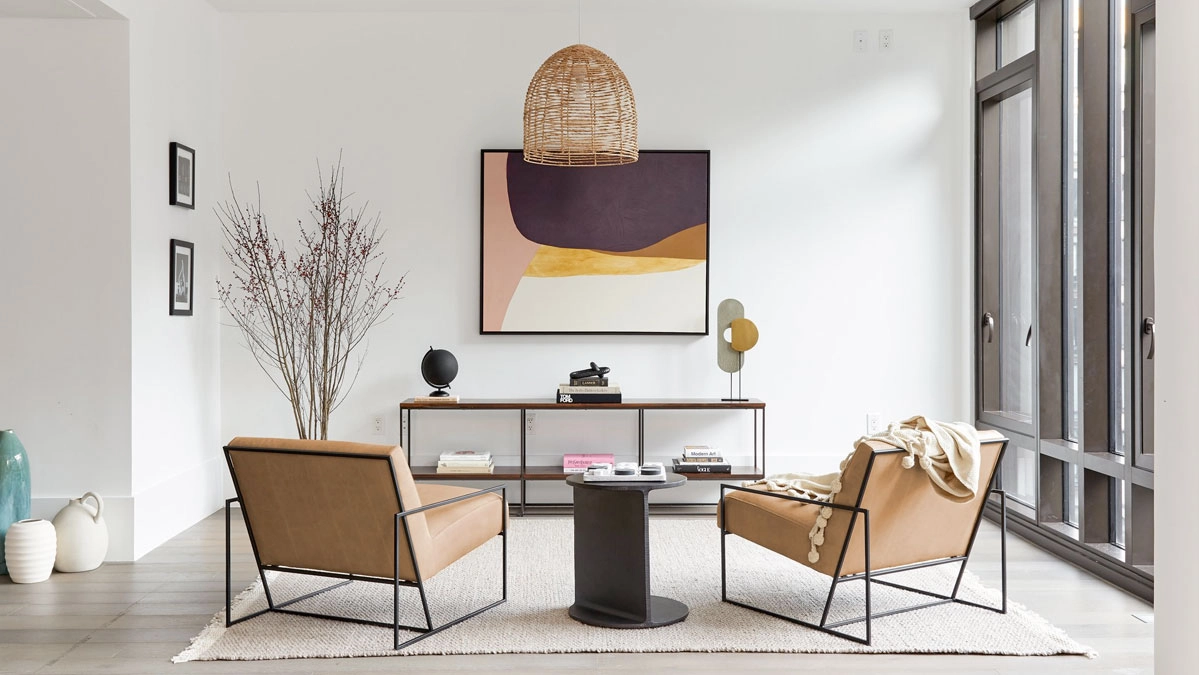 The Mercer steel frame chairs in a bright minimalist and insdustrial style living room