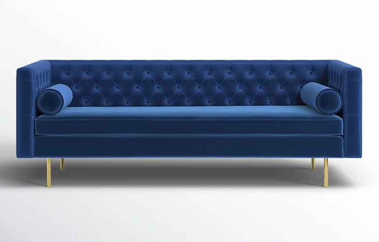 Blue Chesterfield Sofa with two bolster pillows