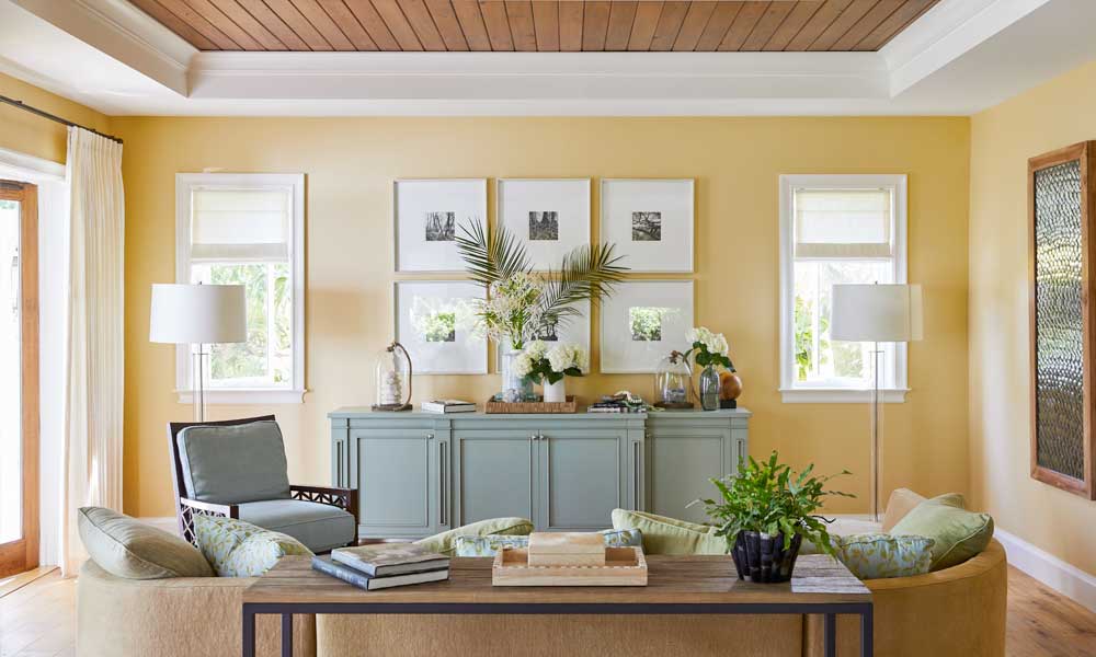 Living room with yeloww walls and wood floors