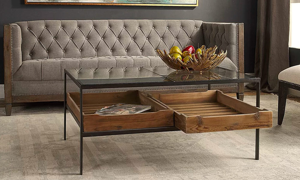 Black metal framed coffee Table with a glass top and two slide-out storage trays