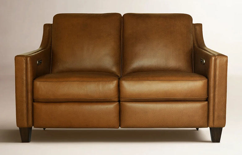 Two seater brown leather upholstered reclining sofa