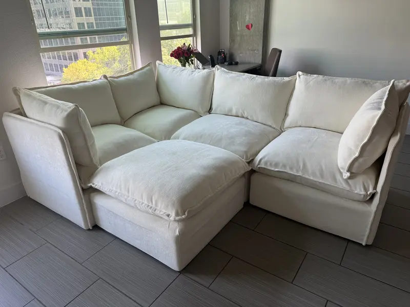 Beige modular couch from Cozey in a bright open apartment in Dallas