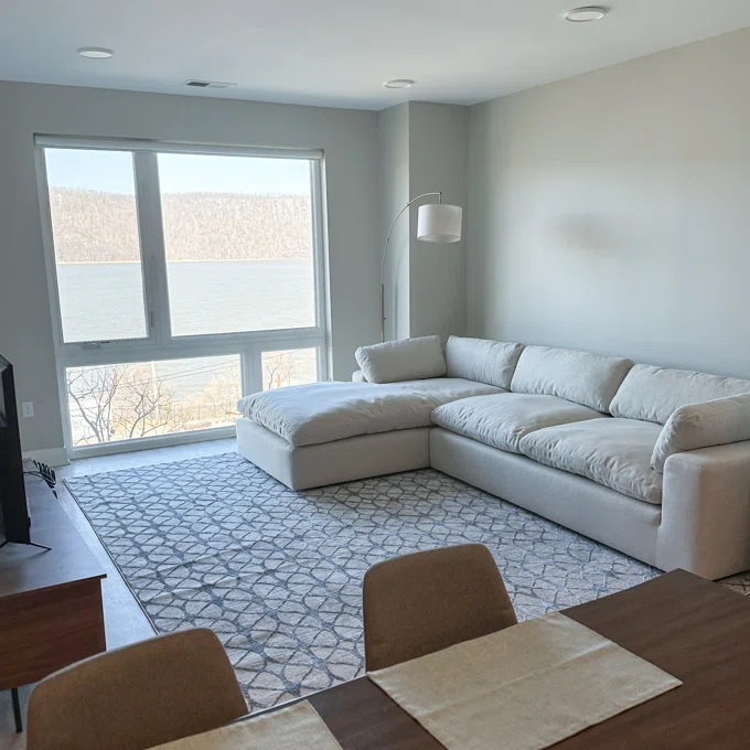 beige couch in a bright living room with modern coffee table
