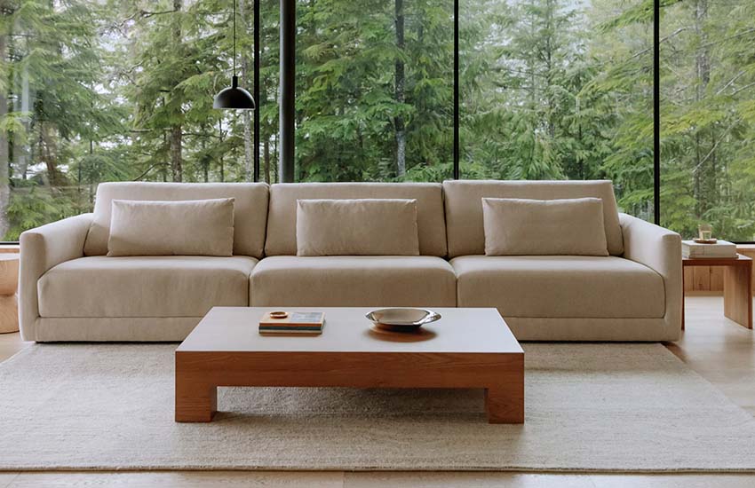 Sundays high-end furniture in a room: sofa, rug, coffe table and side table