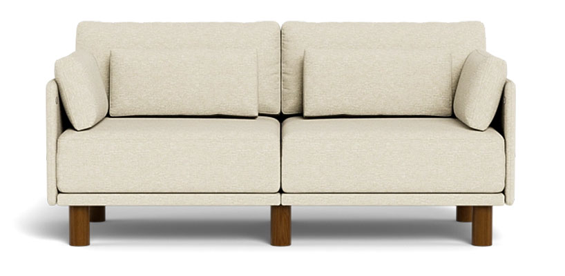 Sofa with tall ooden legs and support pillows