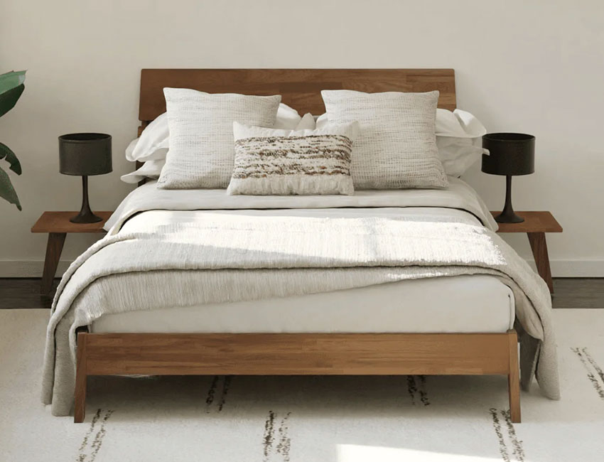 Platform bed with bedding and throw pillows