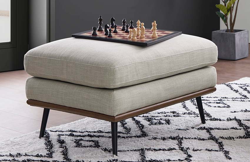 Minimalist grey upholstered ottoman with metal legs