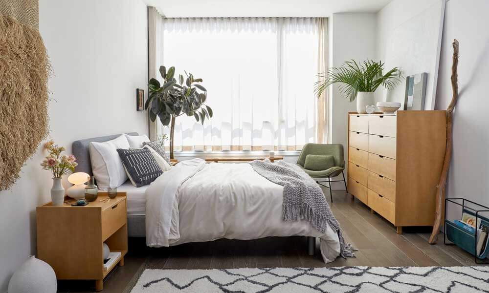 Platform Bed in a bedroom near a big window in a sunny day